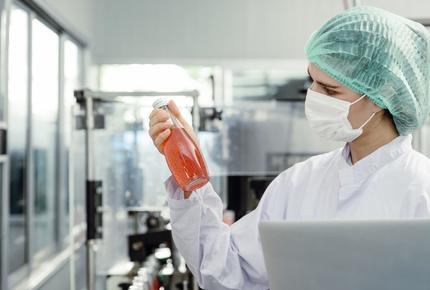 A person checking the quality of the food product in a labratory